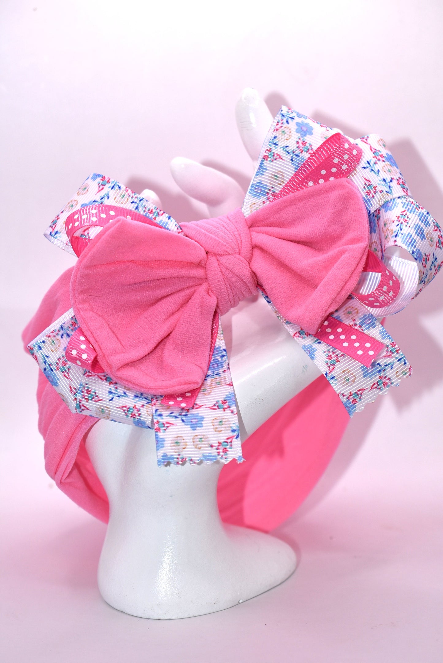 🎀 Elevate your everyday look with this charming wrapped headband featuring a gorgeous blue and pink floral ribbon design! 🌸 The stretchy nylon band adapts to fit all head sizes comfortably, making it the perfect accessory for any outfit—whether you're dressing up or keeping it casual. 💕 Add a pop of color and personality to your style with this versatile must-have! ✨