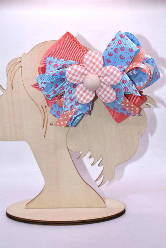 Get ready to turn heads with this adorable hair accessory! 🎀 Featuring luxurious layered ribbons in a fun, stylish design, this piece brings instant charm to any look. 🌸 A pretty orange flower sits perfectly on top, adding that extra pop of personality. The wrapped alligator clip makes it super easy to secure and comfortable to wear all day long. Perfect for spring and beyond! ✨
