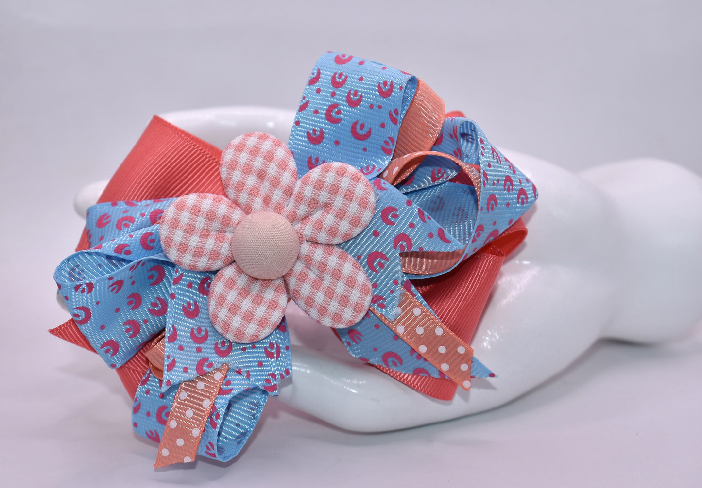 Get ready to turn heads with this adorable hair accessory! 🎀 Featuring luxurious layered ribbons in a fun, stylish design, this piece brings instant charm to any look. 🌸 A pretty orange flower sits perfectly on top, adding that extra pop of personality. The wrapped alligator clip makes it super easy to secure and comfortable to wear all day long. Perfect for spring and beyond! ✨
