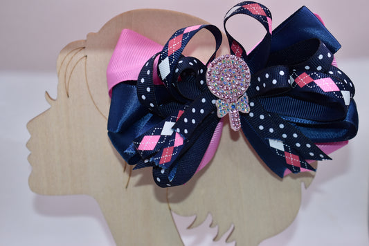 Introducing Nana's Collection A3 – a delightful accessory that's pure charm! 🎀 This adorable alligator clip features a gorgeous blend of pink and blue with beautifully layered ribbons that add dimension and style. ✨ Topped with a sparkling glitter candy charm, it's the perfect finishing touch for any hairstyle. 💖 Sweet, playful, and utterly enchanting – your little one will love showing it off! 🌈