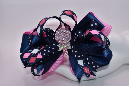 Introducing Nana's Collection A3 – a delightful accessory that's pure charm! 🎀 This adorable alligator clip features a gorgeous blend of pink and blue with beautifully layered ribbons that add dimension and style. ✨ Topped with a sparkling glitter candy charm, it's the perfect finishing touch for any hairstyle. 💖 Sweet, playful, and utterly enchanting – your little one will love showing it off! 🌈