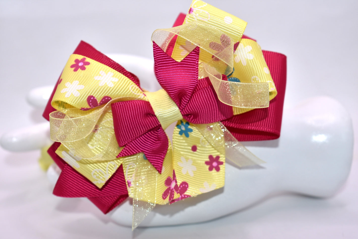 Elevate your style with this stunning bright pink and yellow floral headband! 🌸✨ Crafted from soft, flexible satin, it glides smoothly over your hair without tugging or discomfort. Whether you're heading to brunch, a special event, or just want to add pizzazz to your everyday look, this one-of-a-kind beauty keeps you feeling fabulous all day long. 💛💕 The perfect finishing touch that transforms any outfit from ordinary to absolutely gorgeous!