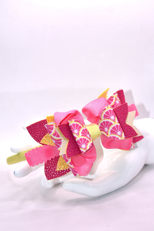 ✨ Introducing Nana's Headband Collection H2 – a one-of-a-kind accessory that's pure joy! 💕 This playful headband features luxurious layers of faux leather and grosgrain ribbon in gorgeous pink and yellow tones that'll brighten any day. The flexible yellow satin base ensures all-day comfort, while sparkling embellishments add that extra dash of fun and personality. 🎀 Whether you're dressing up or keeping it casual, this charming piece brings instant style and whimsy to your look. 🌟