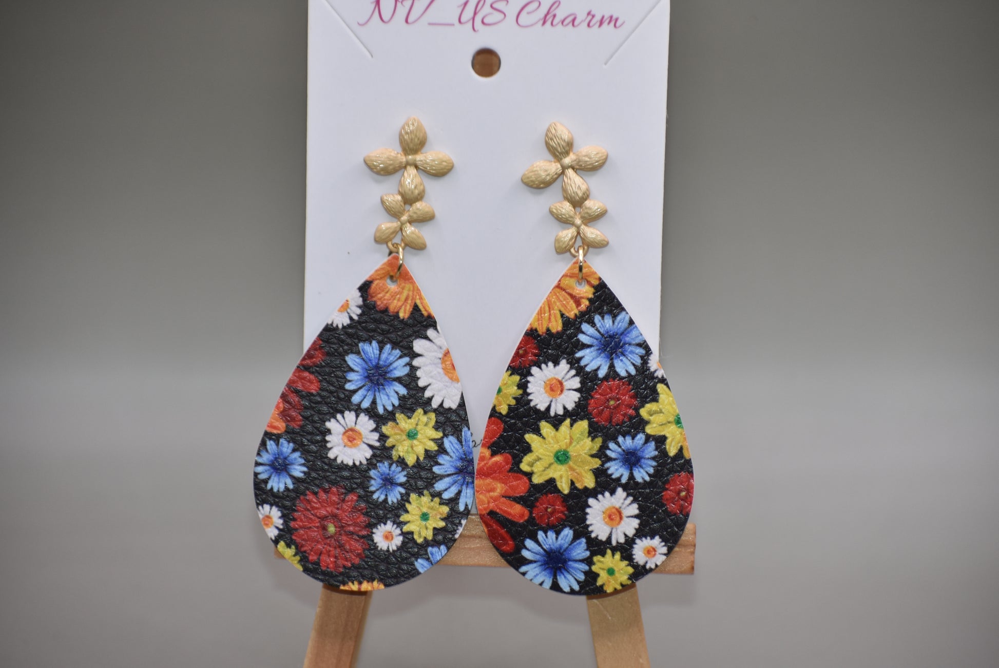 Add a pop of color and quirkiness to any outfit with our Key West Collection earrings! The super fun and bright design features a black background with a vibrant, multi-colored flowered pattern. The unique gold posts add a touch of whimsy, making these earrings truly one-of-a-kind. Get ready to fall in love with these unique flower posts!" 🌺💛