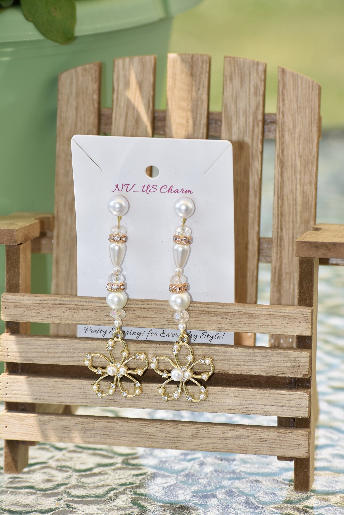 This one of a kind piece of jewelry is a beautiful addition to a bride's special day. The long earring hangs gracefully and is decorated with gorgeous gold crystals and pearls. The pearl posts add an extra touch of sparkle and the gold flower made with pearls and crystals is an exquisite center piece. Perfect for making any bride feel extra special on her wedding day.