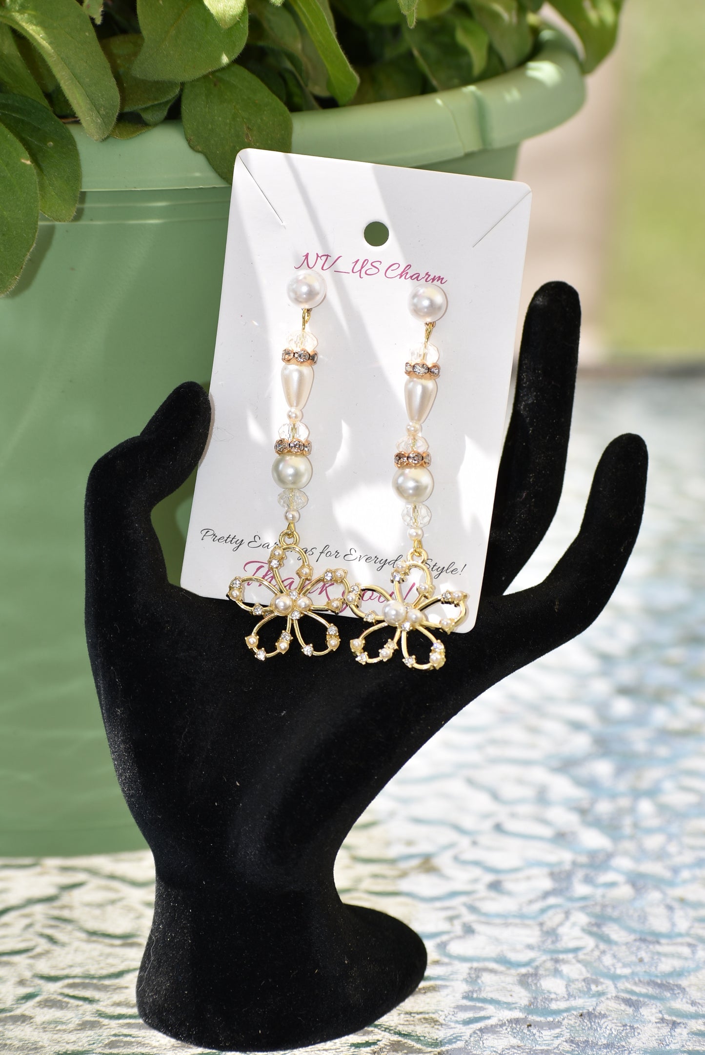 This one of a kind piece of jewelry is a beautiful addition to a bride's special day. The long earring hangs gracefully and is decorated with gorgeous gold crystals and pearls. The pearl posts add an extra touch of sparkle and the gold flower made with pearls and crystals is an exquisite center piece. Perfect for making any bride feel extra special on her wedding day.