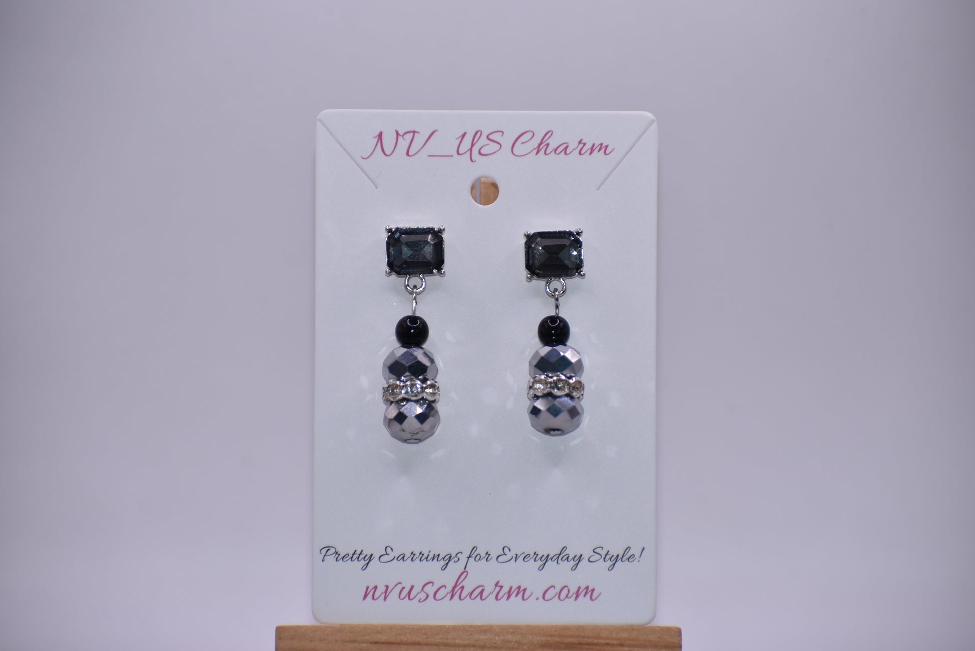 This Black Collection 13 earring set is crafted featuring exquisite black crystal square posts and intricately detailed gray and black beading. This timeless jewelry piece is designed to last, perfect for formal occasions or everyday wear.