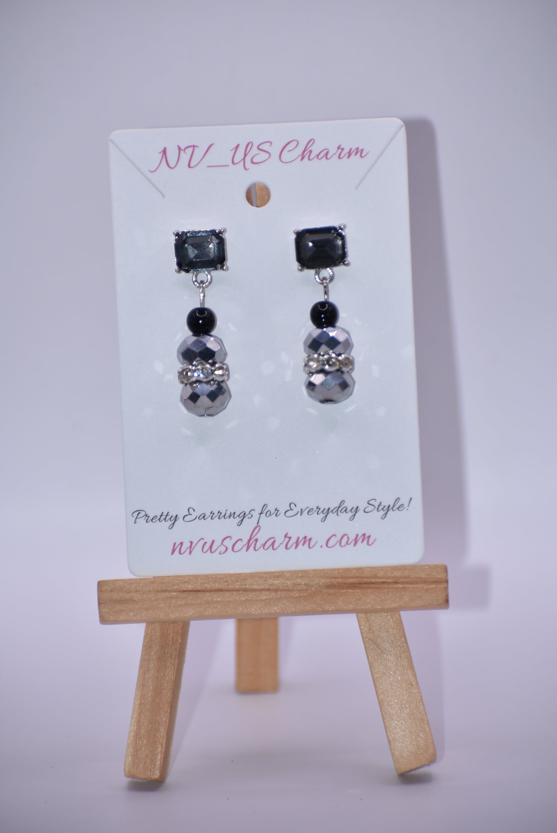 This Black Collection 13 earring set is crafted featuring exquisite black crystal square posts and intricately detailed gray and black beading. This timeless jewelry piece is designed to last, perfect for formal occasions or everyday wear.