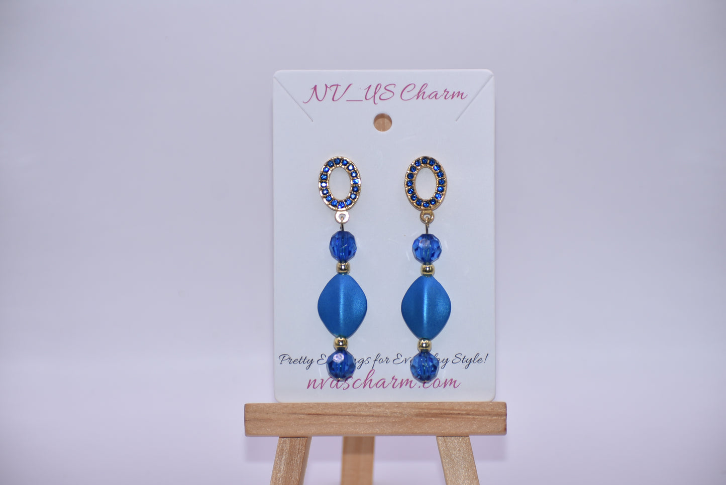 Get ready to dazzle with the Blue Collection 20 earrings! These unique gold and blue crystal oval posts are adorned with stunning shades of blue crystals and beads, making them the perfect accessory for a special evening out. And for those with sensitive ears, fear not - these earrings are hypoallergenic for comfortable wear all night long.