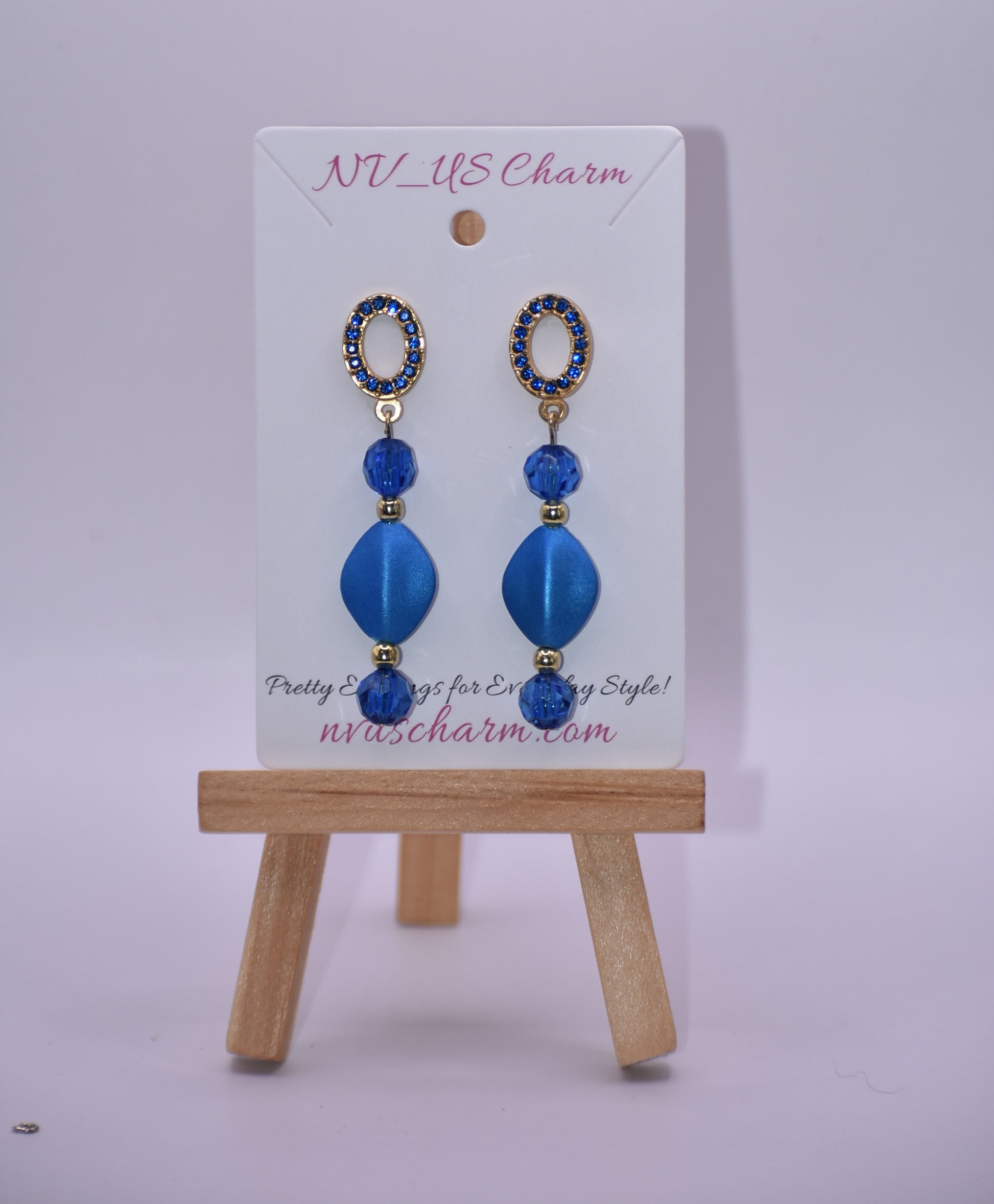 Get ready to dazzle with the Blue Collection 20 earrings! These unique gold and blue crystal oval posts are adorned with stunning shades of blue crystals and beads, making them the perfect accessory for a special evening out. And for those with sensitive ears, fear not - these earrings are hypoallergenic for comfortable wear all night long.