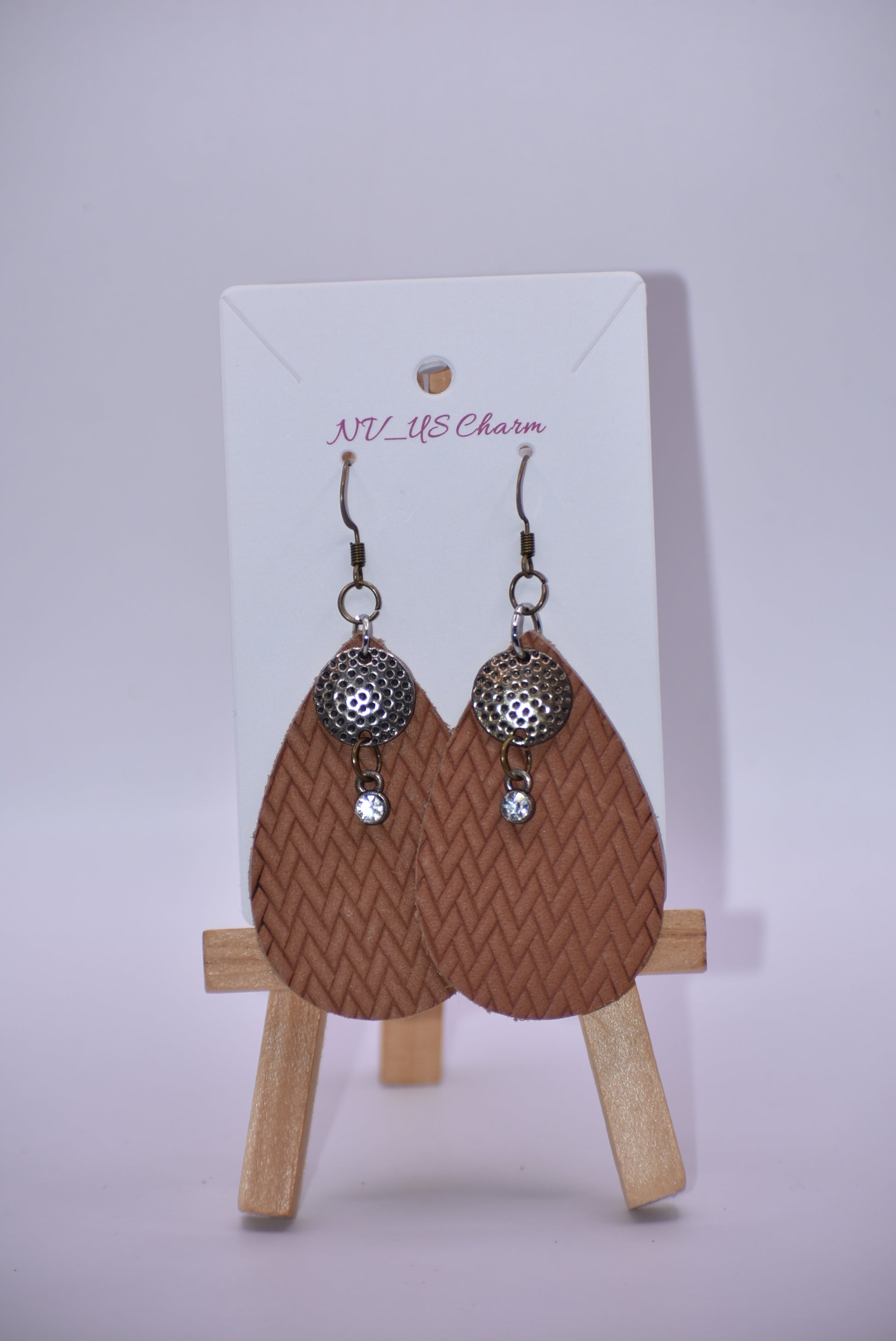 These brown teardrop earrings are so comfortable and easy to wear every day.  Set with a bronze hanging hook for an extra touch of color.