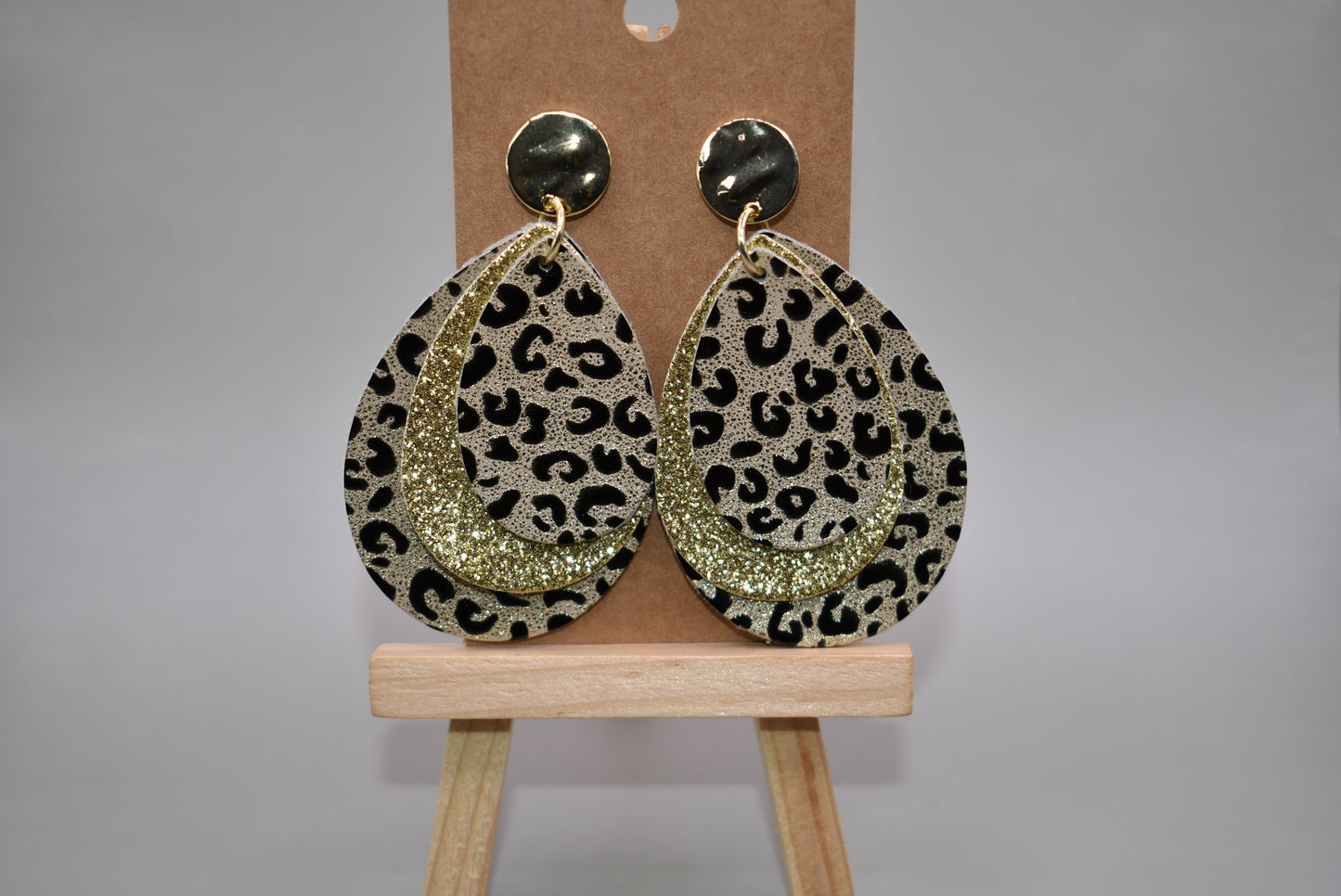 These gold stunners are sure to get attention.  Gold posts and gold glitter and leopard print teardrops bring these earrings to life.  You will be roaring in these. 